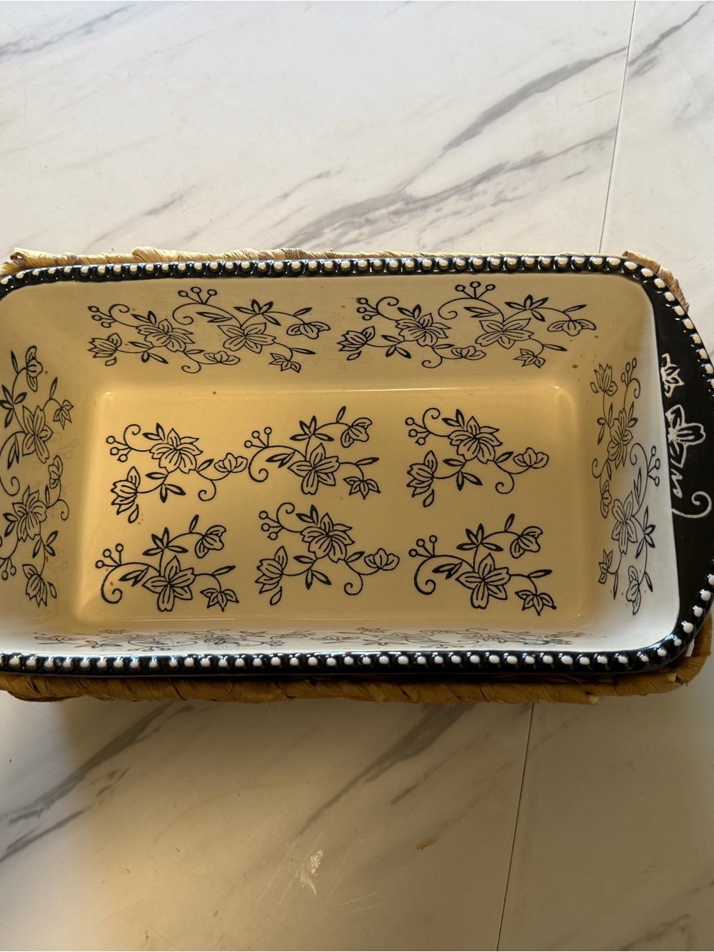 Cream Ceramic Serving Dish with Black Floral Pattern and basket holder